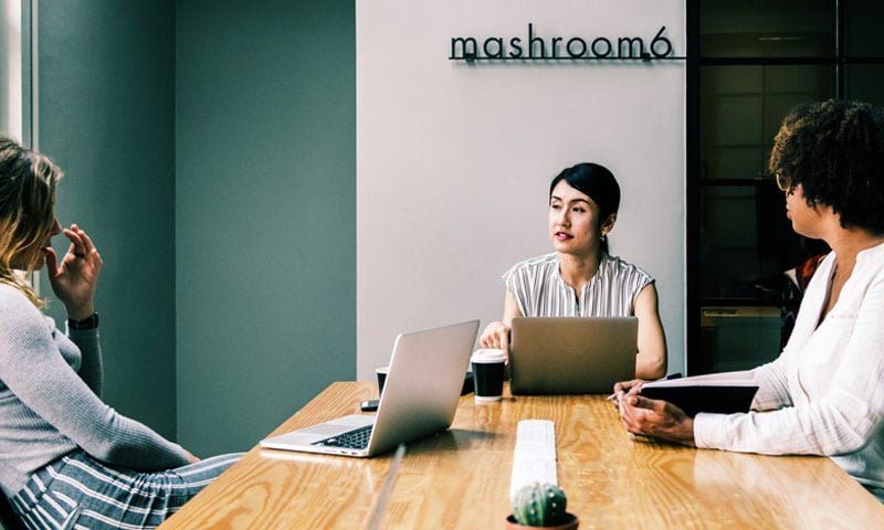 The Urbness team discussing streetwear trends and business strategy at their office in Pueblo, Colorado, representing our journey as a boutique independent reseller.